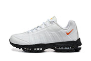 Nike Air Max White and Black Sneakers with Orange Swoosh