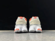 New Balance U9060EGL Sneakers in Grey and Coral