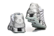 Nike Shox TL Sneakers in White and Metallic Silver